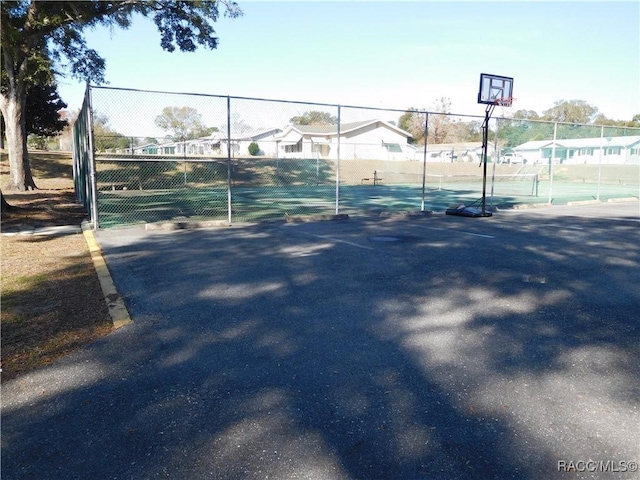 view of tennis court with basketball court