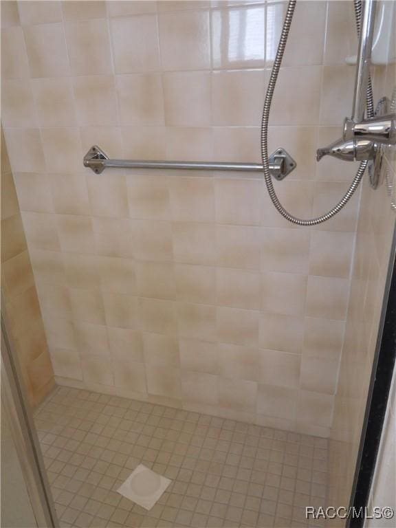 bathroom with tiled shower