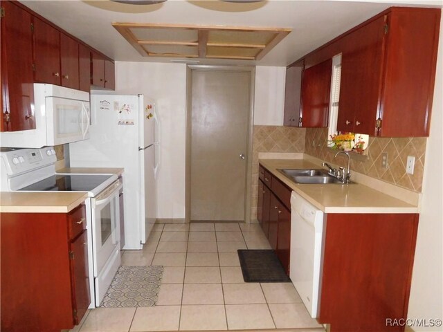 kitchen with sink, white appliances, decorative backsplash, and light tile patterned floors