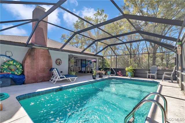 9844 SW 198th Cir, Dunnellon, FL 34432 - outdoor pool featuring a lanai, a ceiling fan, and a patio