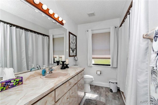 9844 SW 198th Cir, Dunnellon, FL 34432 - bathroom featuring toilet, visible vents, baseboards, wood finished floors, and vanity