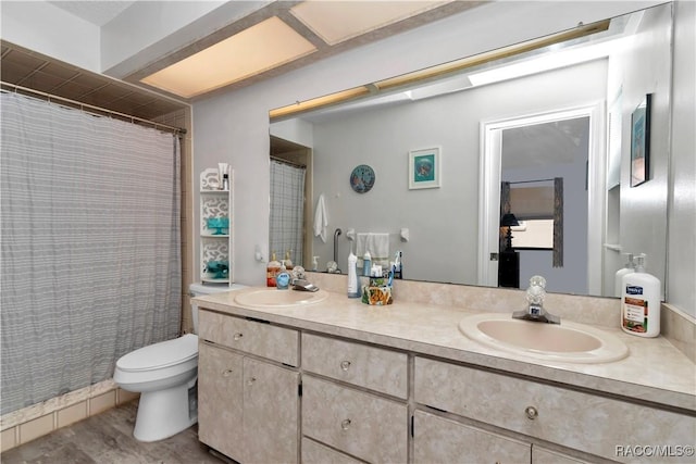 9844 SW 198th Cir, Dunnellon, FL 34432 - bathroom with curtained shower, double vanity, toilet, and a sink