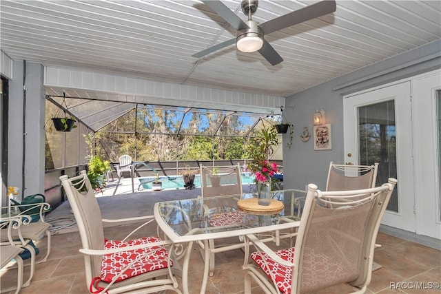 9844 SW 198th Cir, Dunnellon, FL 34432 - sunroom with ceiling fan and outdoor dining area