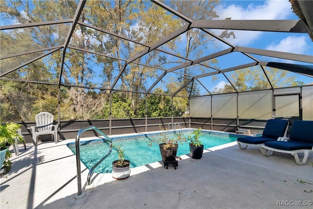 9844 SW 198th Cir, Dunnellon, FL 34432 - outdoor pool featuring a patio area and a lanai