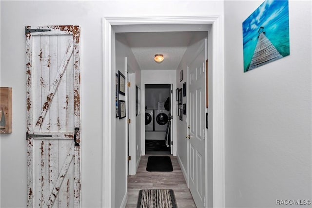 9844 SW 198th Cir, Dunnellon, FL 34432 - hallway with separate washer and dryer, baseboards, and wood finished floors