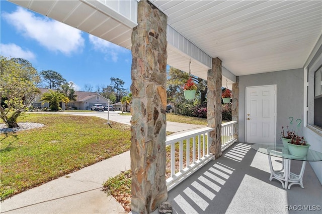 9844 SW 198th Cir, Dunnellon, FL 34432 - view of patio featuring a porch