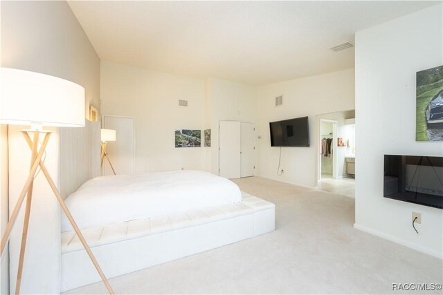 tiled living room with high vaulted ceiling