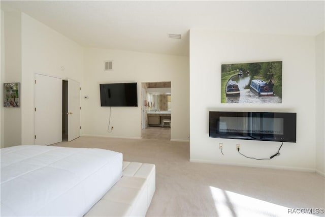 carpeted bedroom featuring lofted ceiling