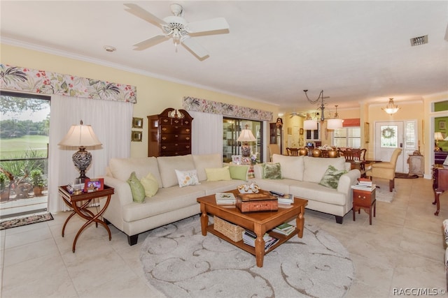 living room with light tile patterned floors, crown molding, ceiling fan, and a healthy amount of sunlight