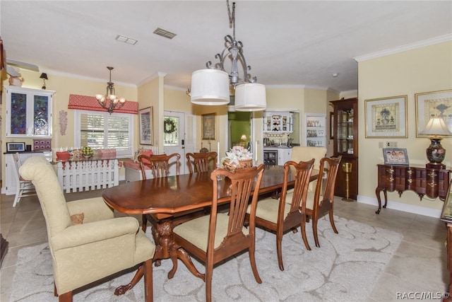 dining area with a notable chandelier and ornamental molding