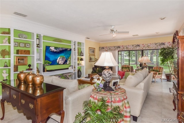 living room featuring light tile patterned floors, ceiling fan, and ornamental molding