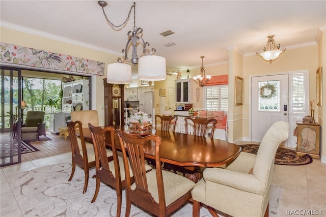 dining space with light tile patterned floors and ornamental molding