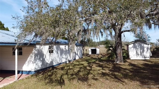 view of property exterior with a shed