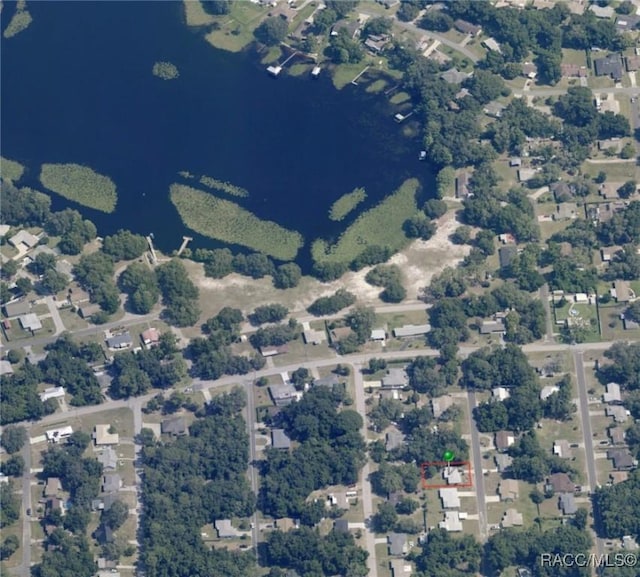 birds eye view of property with a residential view and a water view