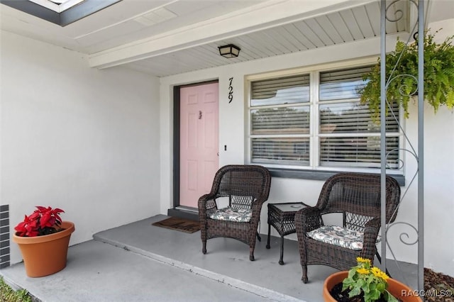 view of exterior entry with stucco siding