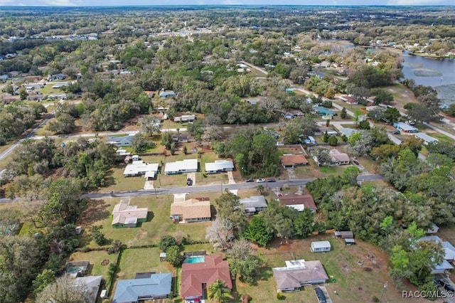 birds eye view of property featuring a residential view and a water view