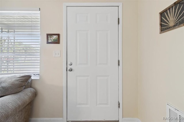 entryway featuring baseboards