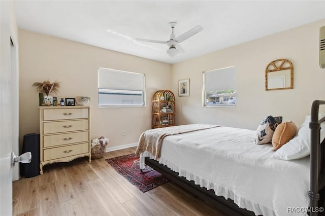 bedroom with ceiling fan and light wood finished floors