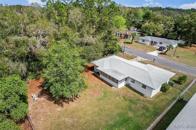 drone / aerial view with a view of trees