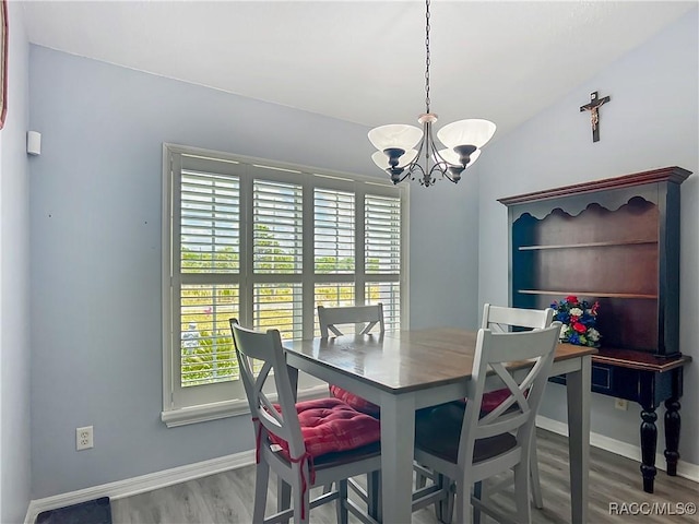 2478 W Angola Dr, Beverly Hills, FL 34465 - dining room with a chandelier and wood finished floors