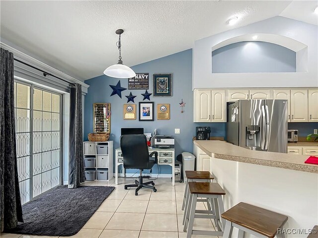 2478 W Angola Dr, Beverly Hills, FL 34465 - office space with vaulted ceiling, healthy amount of natural light, and light tile patterned floors