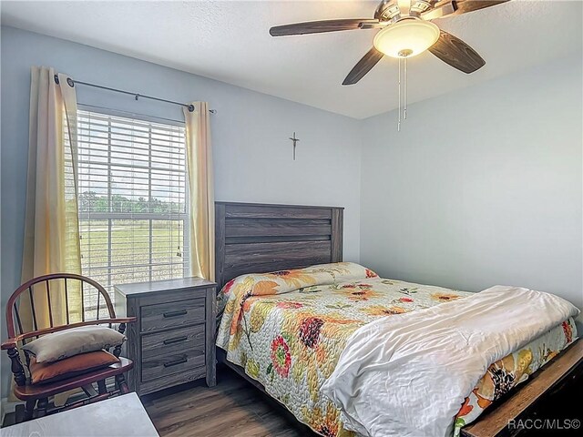 2478 W Angola Dr, Beverly Hills, FL 34465 - bedroom featuring dark wood-style flooring and ceiling fan