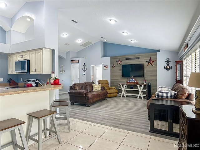 2478 W Angola Dr, Beverly Hills, FL 34465 - living room featuring lofted ceiling and light tile patterned floors