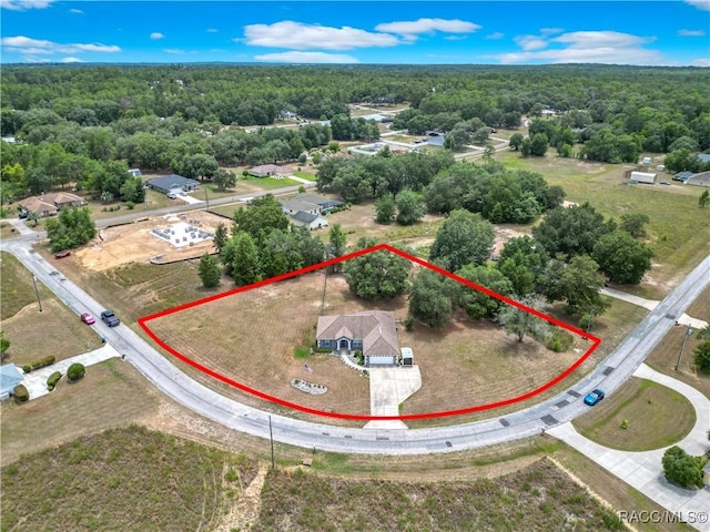 2478 W Angola Dr, Beverly Hills, FL 34465 - aerial view of property and surrounding area with property parcel outlined and a forest