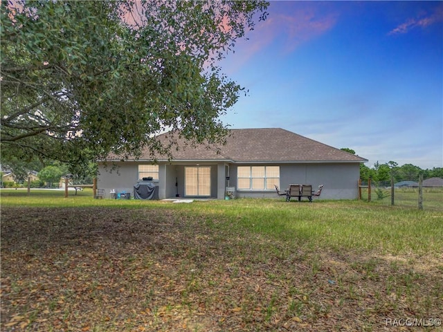 2478 W Angola Dr, Beverly Hills, FL 34465 - rear view of house featuring stucco siding
