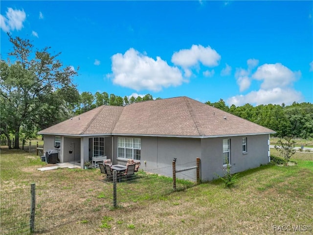 2478 W Angola Dr, Beverly Hills, FL 34465 - rear view of property featuring stucco siding, a patio, and a shingled roof