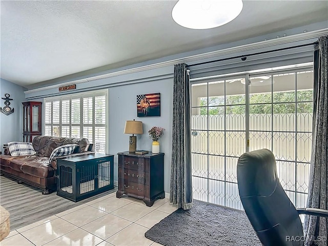 2478 W Angola Dr, Beverly Hills, FL 34465 - living room featuring tile patterned flooring and plenty of natural light