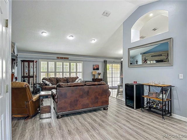 2478 W Angola Dr, Beverly Hills, FL 34465 - living room with light wood finished floors, lofted ceiling, and recessed lighting