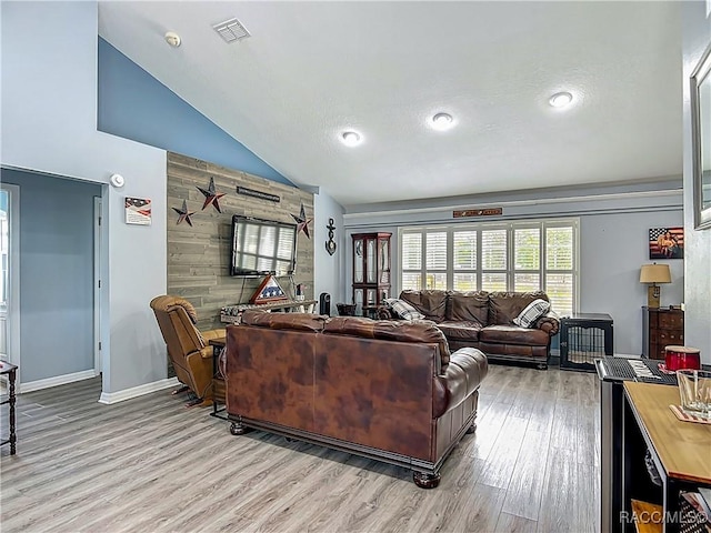 2478 W Angola Dr, Beverly Hills, FL 34465 - living room featuring light wood-style flooring, vaulted ceiling, and recessed lighting