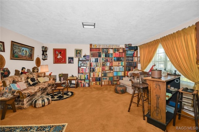 interior space with visible vents, a textured ceiling, and carpet