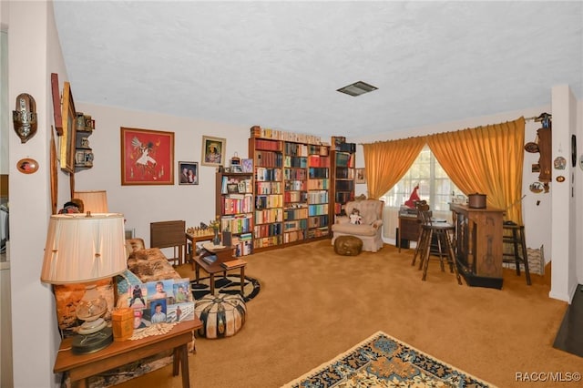 sitting room with carpet flooring