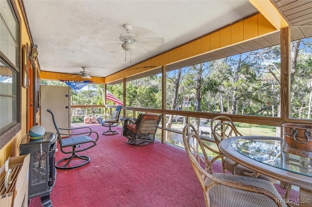 sunroom / solarium with ceiling fan