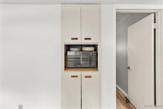 interior details with hardwood / wood-style flooring