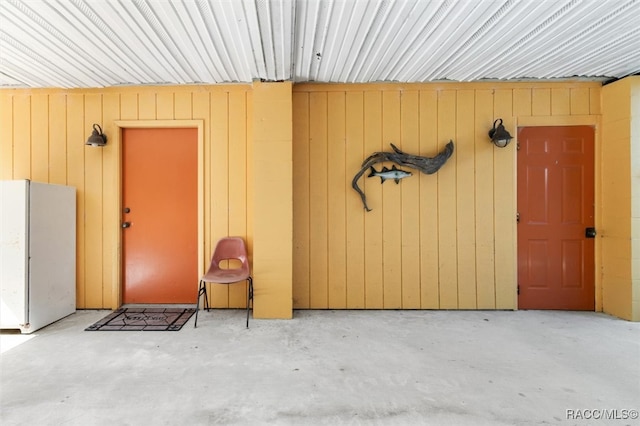 garage featuring white fridge