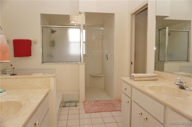 3033 N Chandler Dr, Hernando, FL 34442 - full bathroom with tiled shower, tile patterned flooring, and two vanities
