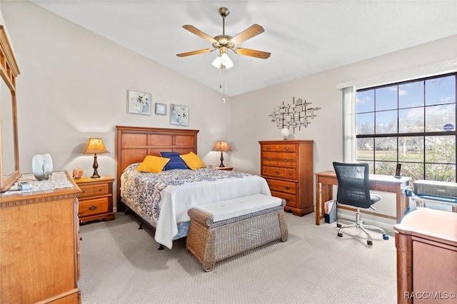 carpeted bedroom with ceiling fan and lofted ceiling