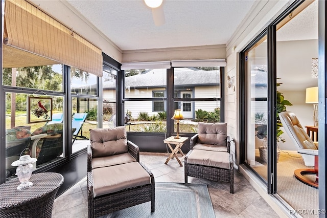 sunroom featuring ceiling fan