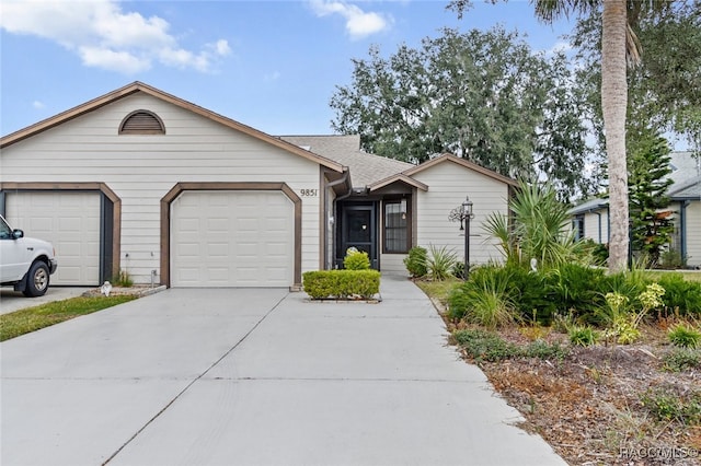 ranch-style house featuring a garage