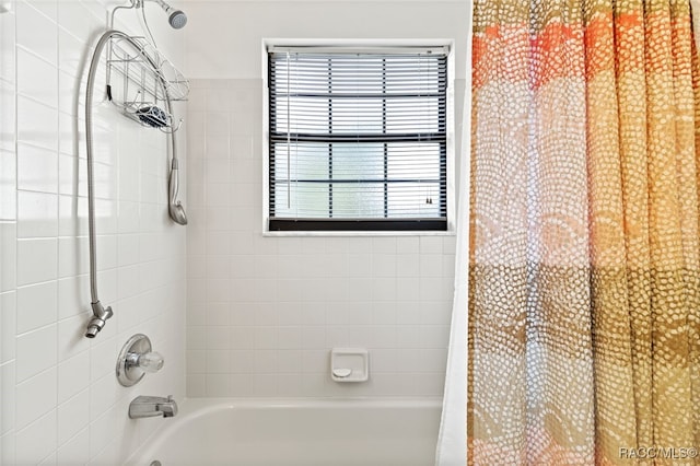 bathroom featuring shower / bathtub combination with curtain