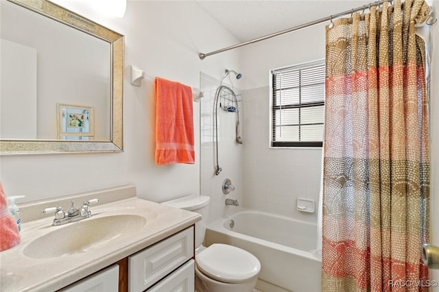 full bathroom with vanity, shower / bath combo, and toilet