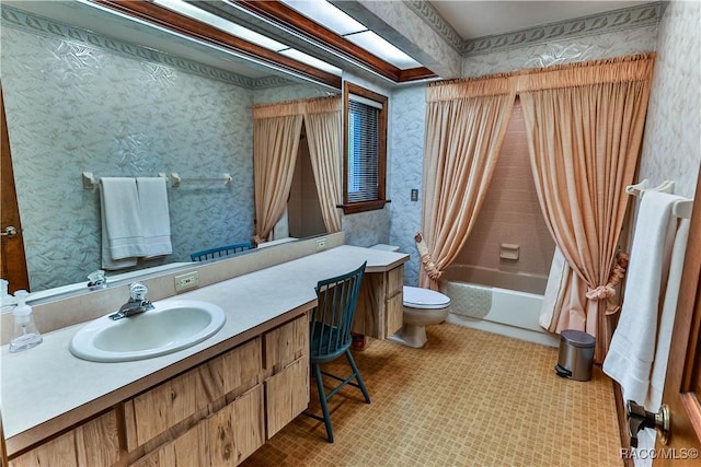 full bathroom with vanity, toilet, and shower / bath combo with shower curtain