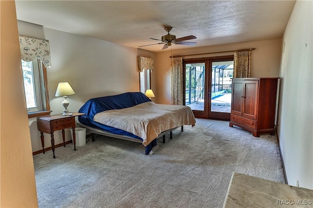 bedroom with access to exterior, ceiling fan, and light carpet