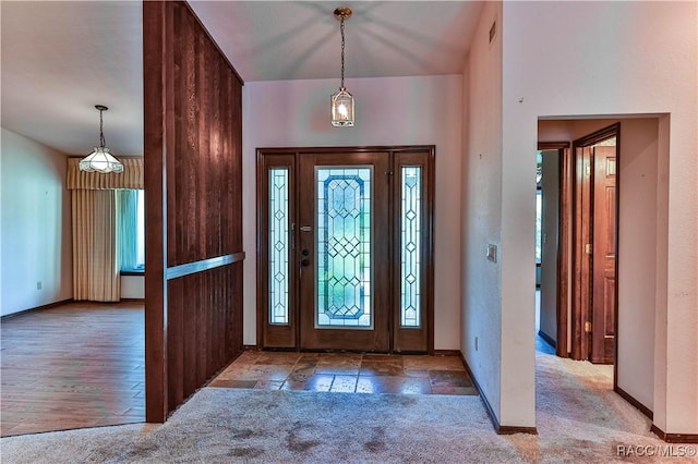 carpeted entryway with a wealth of natural light