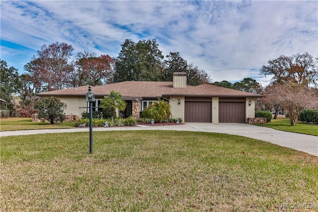 single story home featuring a front yard and a garage