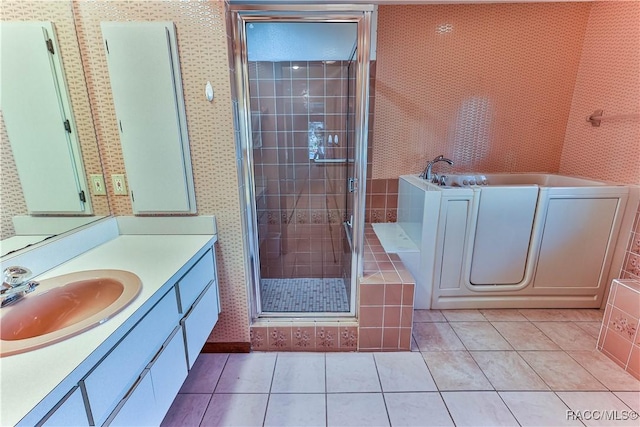 bathroom with tile patterned flooring, vanity, and a shower with shower door