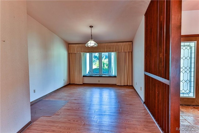 unfurnished dining area with hardwood / wood-style flooring